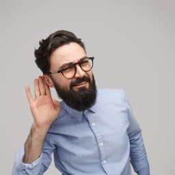 Bearded man listening closely