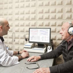 Man having his hearing tested at an audiology clinic