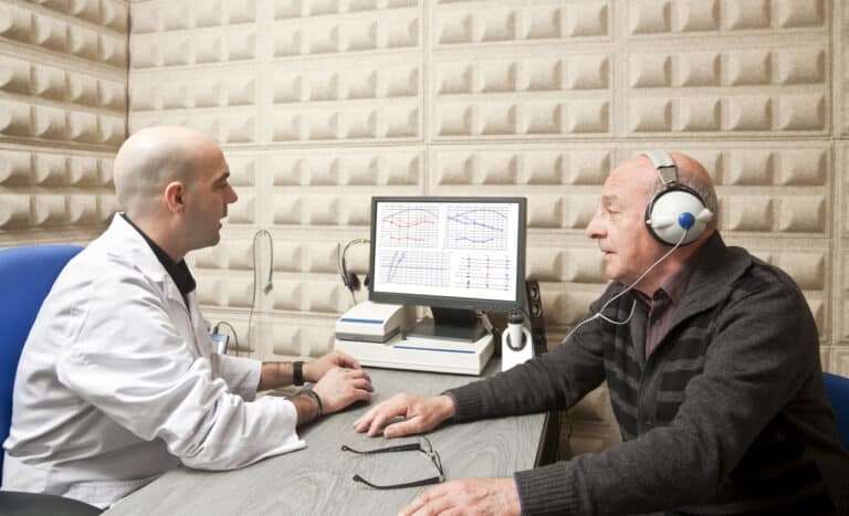 Man having his hearing tested at an audiology clinic 