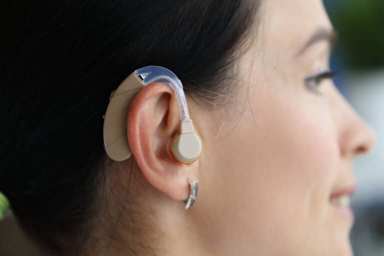 Close up of a woman with a hearing aid