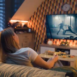 Couple watches action movie at home