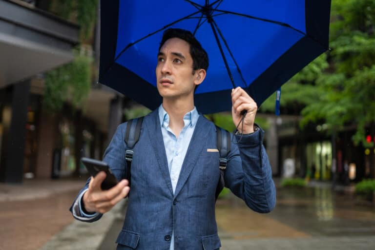 Man with hearing aid in the rain