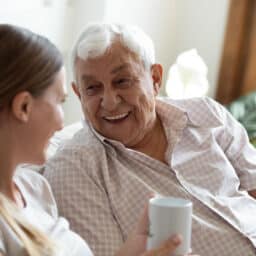 Senior man laughing with his daughter