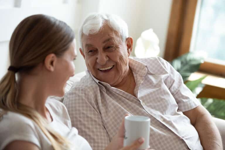 Senior man laughing with his daughter