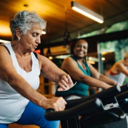 Group of senior women exercising together at the gym