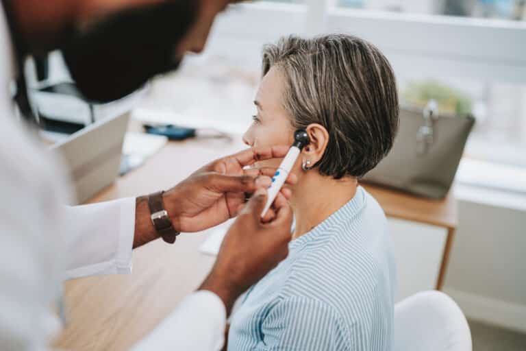 Woman gets ear examined
